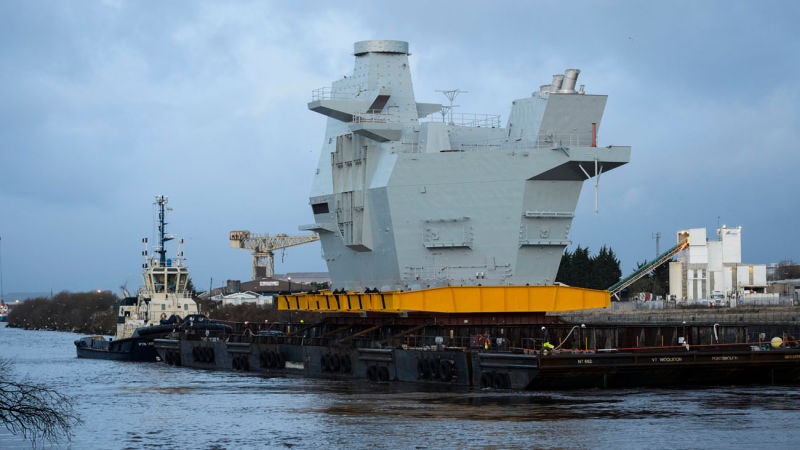 The Graceful Voyage of a Mountain-Sized Section of Aircraft Carrier 