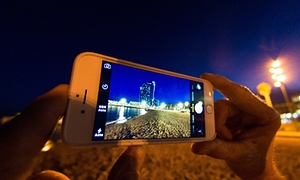 An iPhone late at night on the beach.