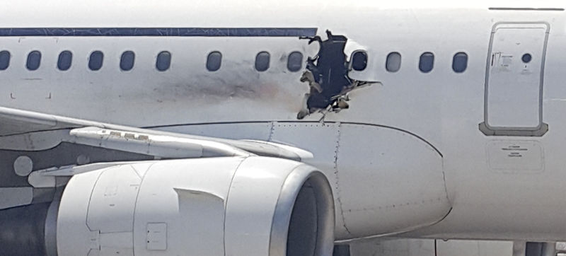 Airplane Makes Safe Landing Despite Having Huge Hole Blown in Fuselage