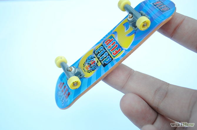 Image titled 360 Flip on a Tech Deck Step 4
