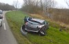 Bizarre images: biker almost crushed by car [updated]