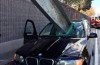 BMW X5-driver unhurt after bizarre accident
