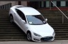 Write a caption: Tesla rider understands stairs not
