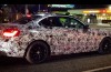 Here drive the (heavily camouflaged) BMW M2