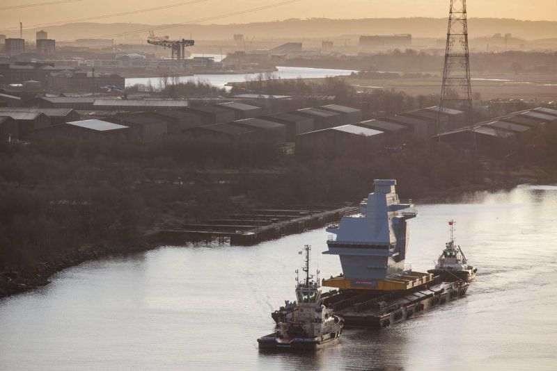 The Graceful Voyage of a Mountain-Sized Section of Aircraft Carrier 