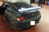 Matte black BMW Z4M Coupe with luminous spoiler is weird