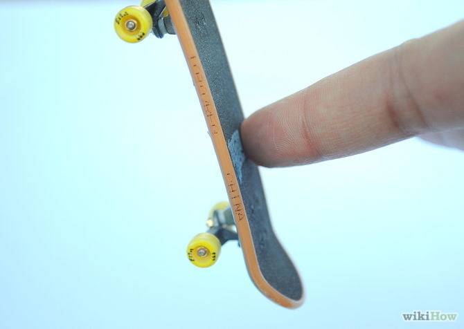 Image titled 360 Flip on a Tech Deck Step 3