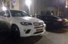 BMW and Porsche parking on the disabled parking place