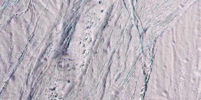 We Still Don't Understand These Spots on Saturn's Moon, and We're Not Going Back