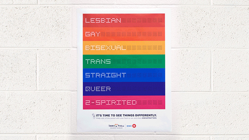 A Camera Flash Reveals This Poster's Secret LGBTQ Support Message
