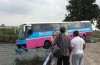 Coach crashes in Amsterdam, dangles above the water