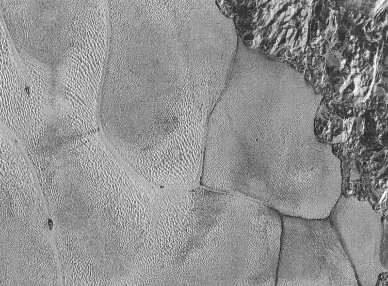 NASA’s New Photos Bring Pluto’s Surface Into Sharp Focus