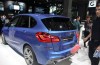 Beursdude brushing his dream car, the 2 Series Active Tourer