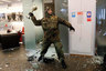 An ultra-right activist attacks an Alfa bank office in central Kiev, Ukraine, Saturday, Feb. 20, 2016.