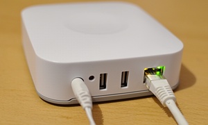 Power, ethernet and a couple of USB ports add to the wireless connections in the back of the SmartThings Hub.