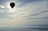 Balloons flying into space, gaining momentum